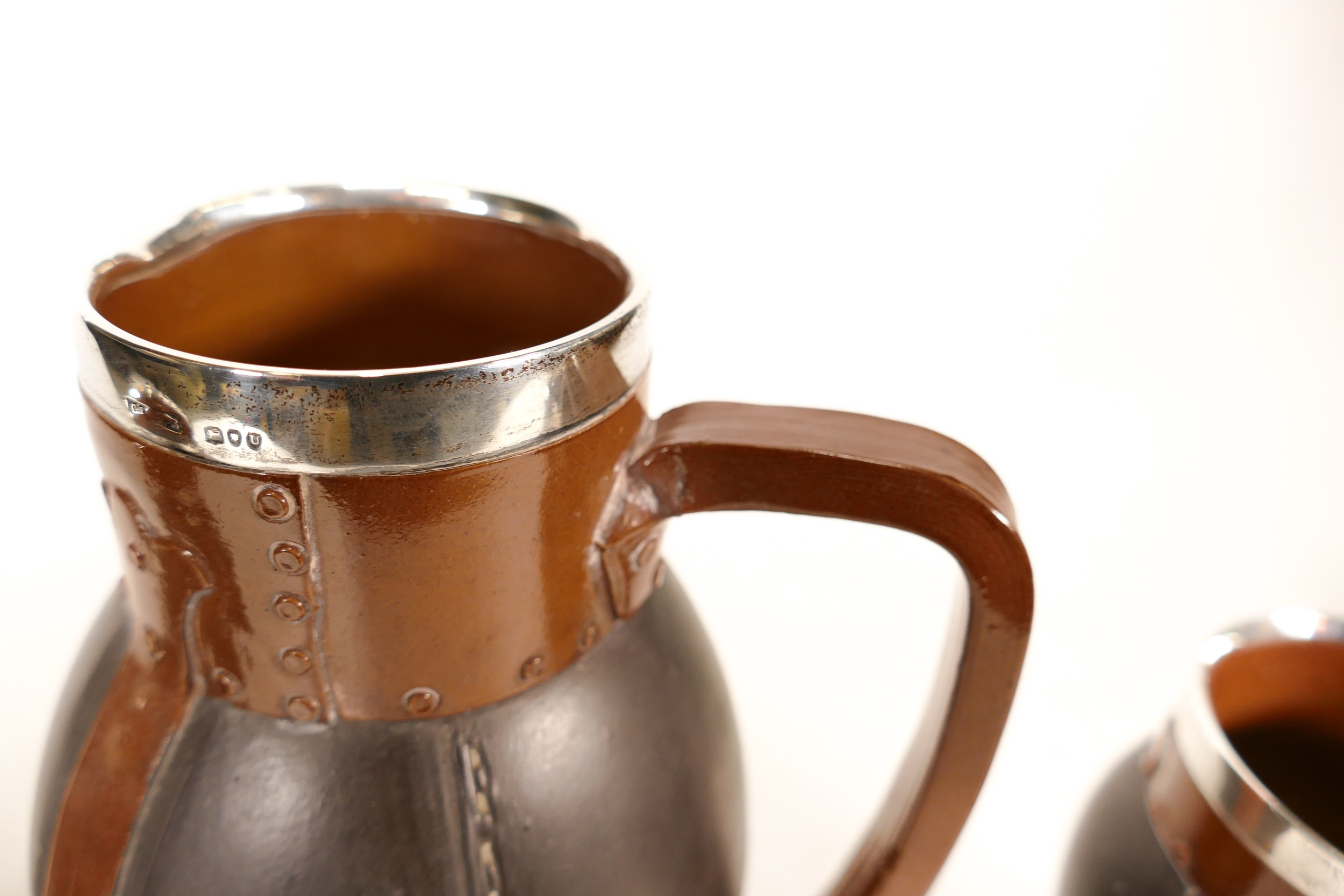 Doulton Lambeth Silver Rimmed Silicon Leather Ware Jug and Two Cups. Handle of Jug is restored - Image 5 of 6