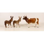 Two beswick Donkey Foals 2110 together with Beswick Ayrshire Cow 1350.