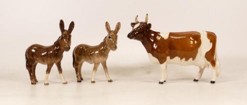 Two beswick Donkey Foals 2110 together with Beswick Ayrshire Cow 1350.