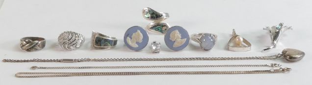 Small group of sterling silver jewellery includes - 5 x silver rings, small & large pendant, locket,