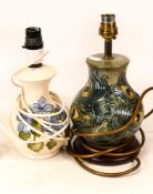 Moorcroft Peacock feather lamp base together with campanula lamp base. Height of tallest including