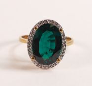 Lab Grown Emerald & Diamond Halo Ring 4.68ct in 375 9ct Gold - Featuring an exquisite oval cut,
