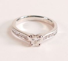 Princess cut Diamond ring with Diamond shoulders in Platinum The princess cut diamond measures 3.8mm