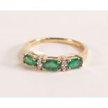 18ct Gold Ring with Marquise cut Emerald and Diamond The 18ct Gold band is stamped 750 and 18K.