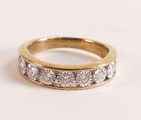 9ct Gold Illusion Set Diamond Eternity Ring. There are nine brilliant cut white diamonds measuring