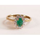 9ct Gold Ring with Emerald and Diamond Halo - The head of the ring measures in total 10.24mm x 8.
