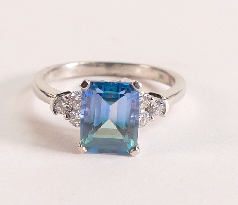 9ct White Gold Ring with Blue Green Topaz and Diamonds This stunning blue green Topaz is emerald