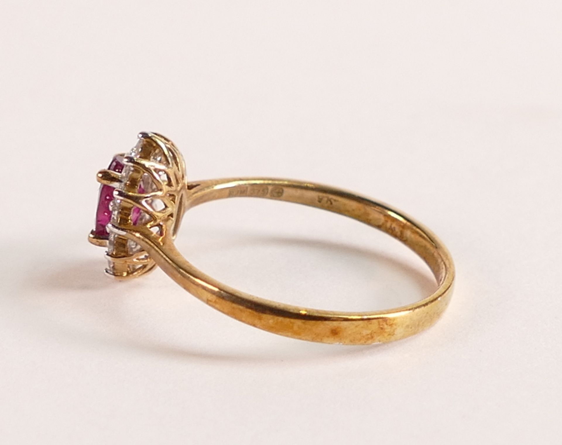 9ct Gold Marquise Cut Ruby and Diamond ring - Marquise cut Ruby with a halo of ten Diamonds. Ruby - Image 2 of 3