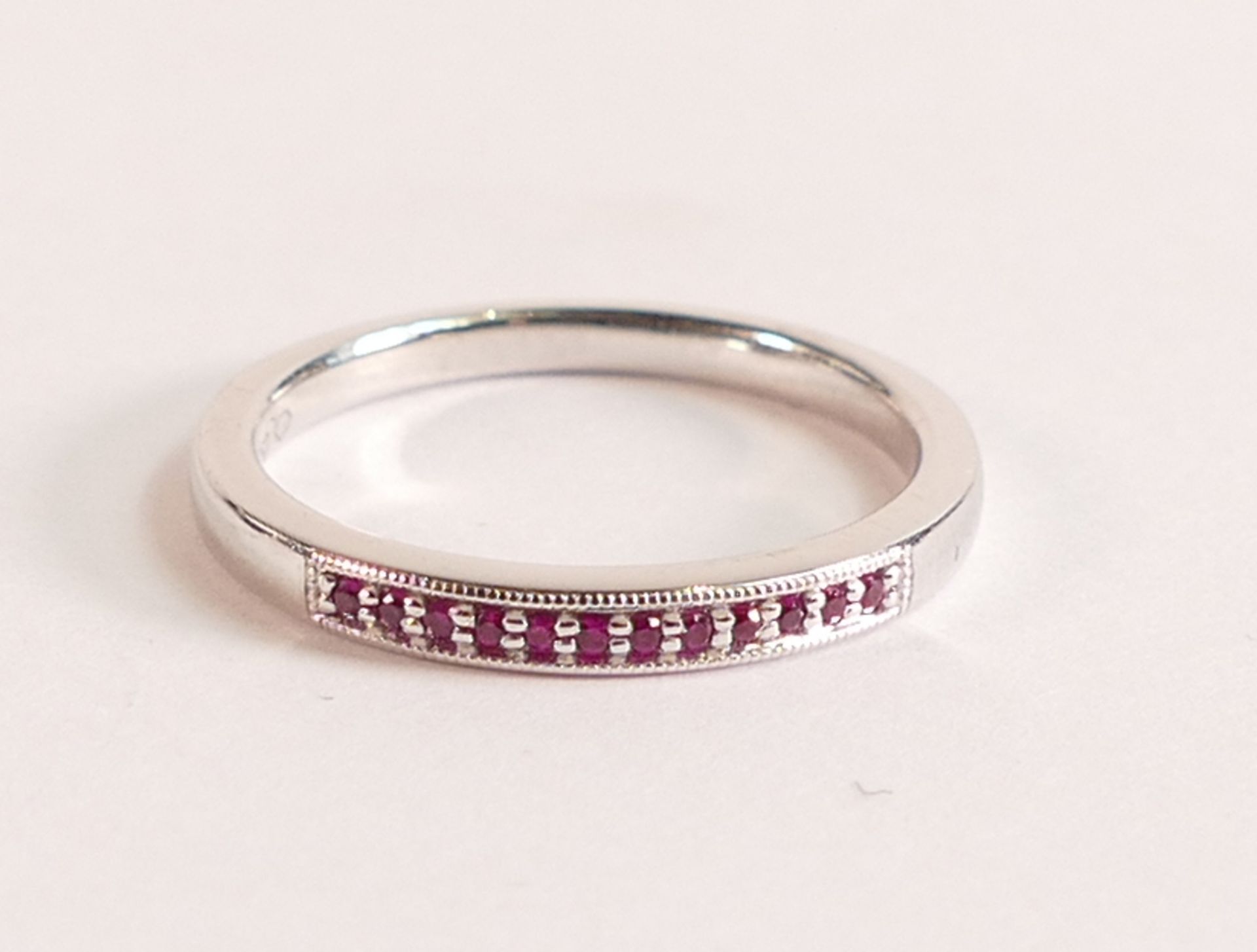 18ct White Gold and Ruby Ring - This sleek half eternity ring is made in 18ct White Gold and is