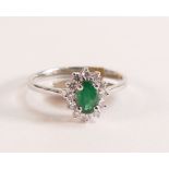 9ct White Gold Ring with Emerald and Diamond Halo The head of the ring measures in total 10.24mm x