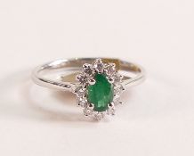 9ct White Gold Ring with Emerald and Diamond Halo The head of the ring measures in total 10.24mm x