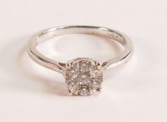. 9ct White Gold and Diamond Cluster Ring The ring is 9ct White Gold and hosts seven Diamonds The