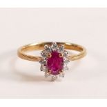 9ct Gold Marquise Cut Ruby and Diamond ring - Marquise cut Ruby with a halo of ten Diamonds. Ruby