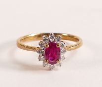 9ct Gold Marquise Cut Ruby and Diamond ring - Marquise cut Ruby with a halo of ten Diamonds. Ruby