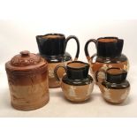 A Collection of Five Stoneware Items to include Lidded Tobacco Pot and Four Doulton Lambeth Jugs