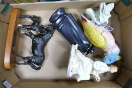 A collection of damaged items to include Black Beauty & Foal, Beswick Parrot etc