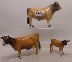 A Beswick Jersey bull, cow and calf group (3)