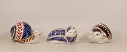 Royal Crown Derby paperweights to include Artic Fox, Hedgehog and Garden Snail. All silver