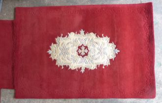 Two Indian Handmade Red Floor Carpets. Size of largest, Length: approx 175cm Width of Largest: 122cm