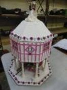 Hobbyist made dolls house in a wedding day theme with dolls accesories inside