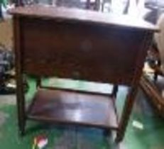 Early 20th century sewing table on metal castors