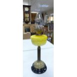 A 19th Century Brass Duplex Burner Oil Lamp on Earthenware Base. Fluted Brass Column with Yellow