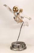 Sc-fi unmarked figure of astronaut flying through space, chip at base, height 46cm