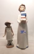 Nao figure of boy carrying books together with Girl with umbrella (2) height of tallest 28cm