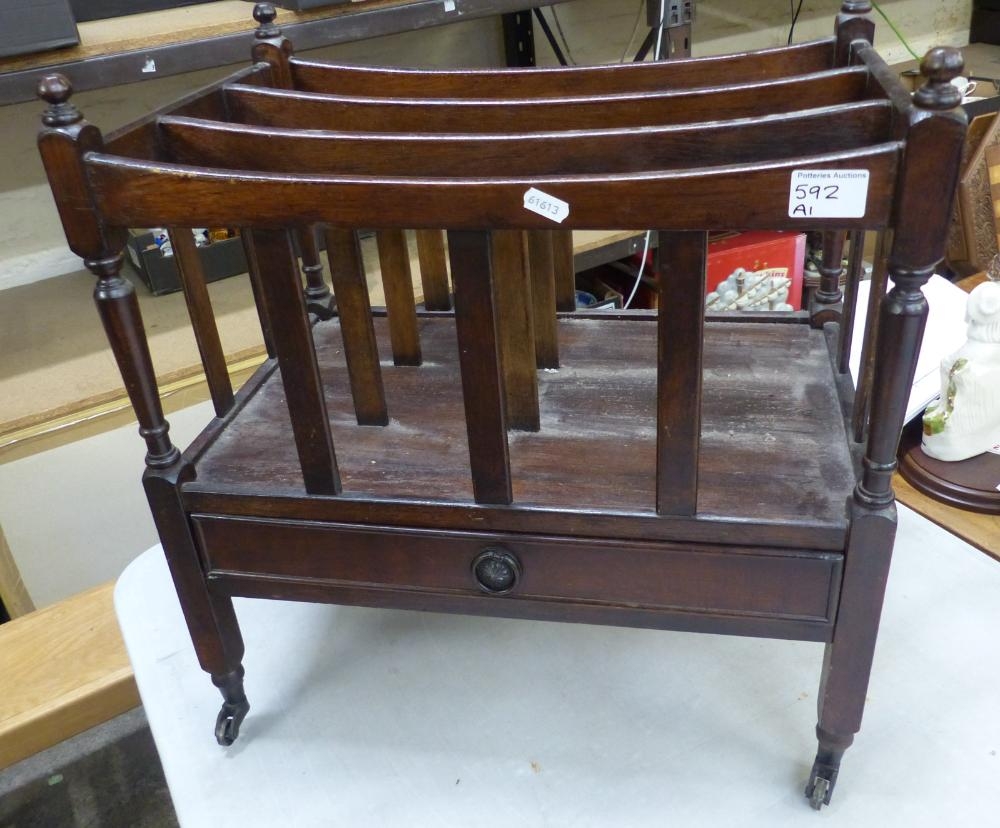 Oak canterbury magazine rack with single drawer to front stood on brass castors (1 castor loose - Image 2 of 2