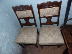 A Pair of Early 20th Century Upholstered Dining Chairs with Carved Back Pediments. Height: 99cm