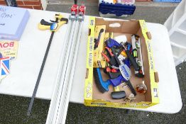 A collection of DIY hand tools including clamps, tile cutters, hammers etc