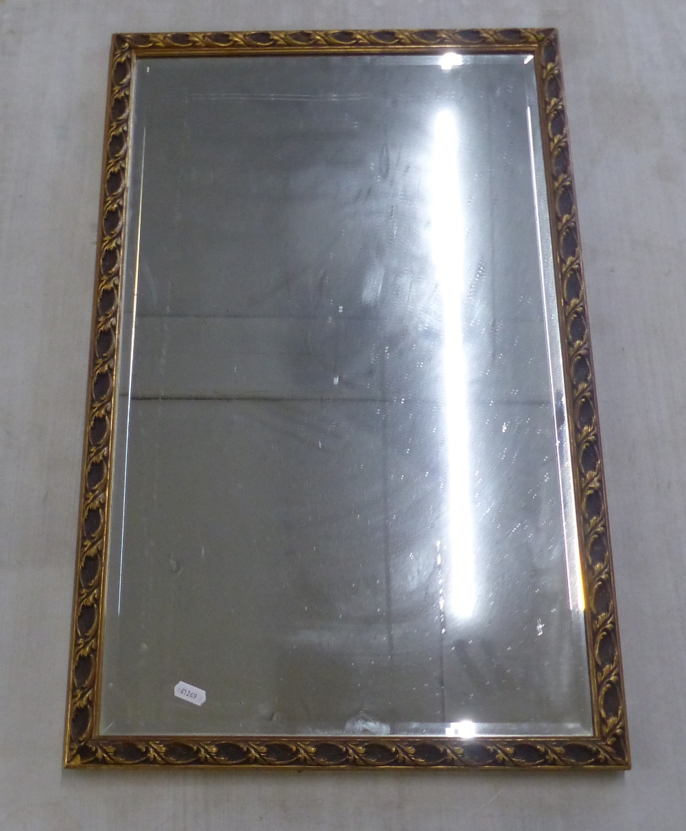 Rectungular Gilt Framed Modern Hall Mirror with Leaf Pattern Frame. Height: 70cm Width: 44.5cm