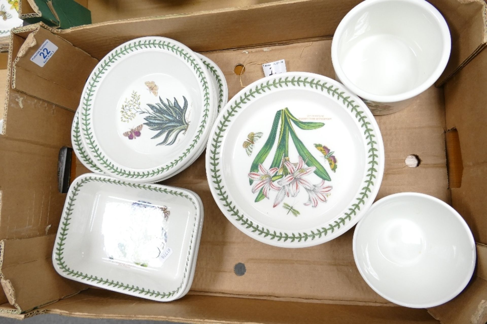 A collection of Portmeirion Botanic patterned items including bowl, storage pots, oblong serving