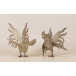 Two White Metal Fighting Cocks, likely Thai. Height: 13cm (2)