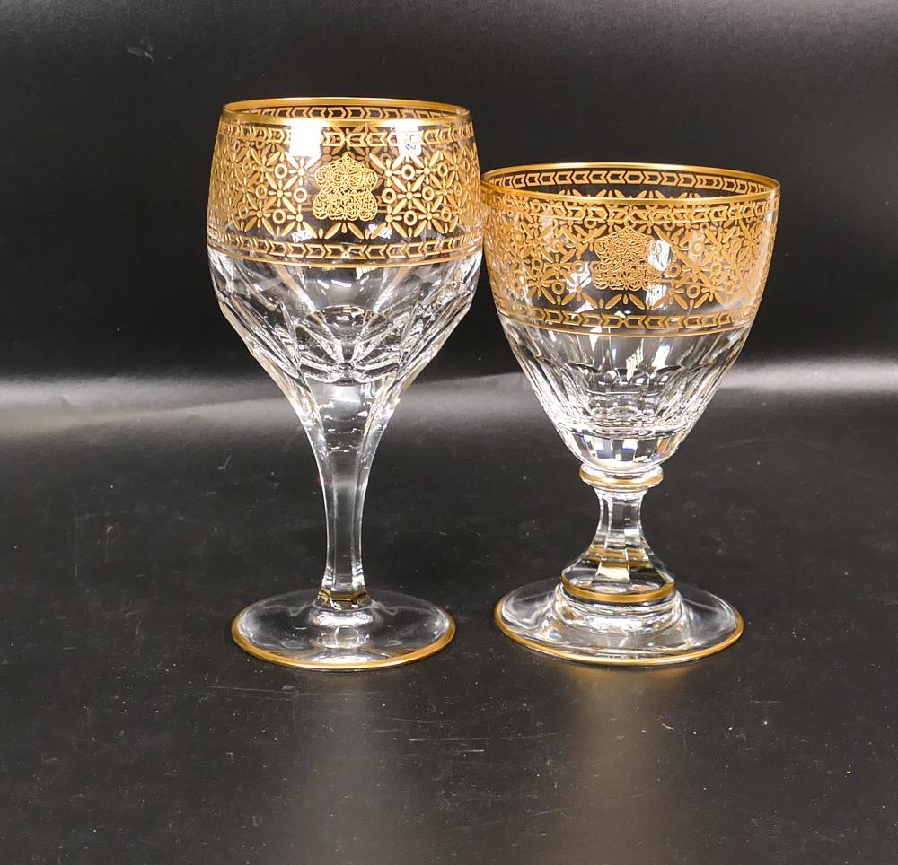 Two De Lamerie Fine Bone China heavily gilded Non Matching Wine Glasses with Arabic Motif, specially