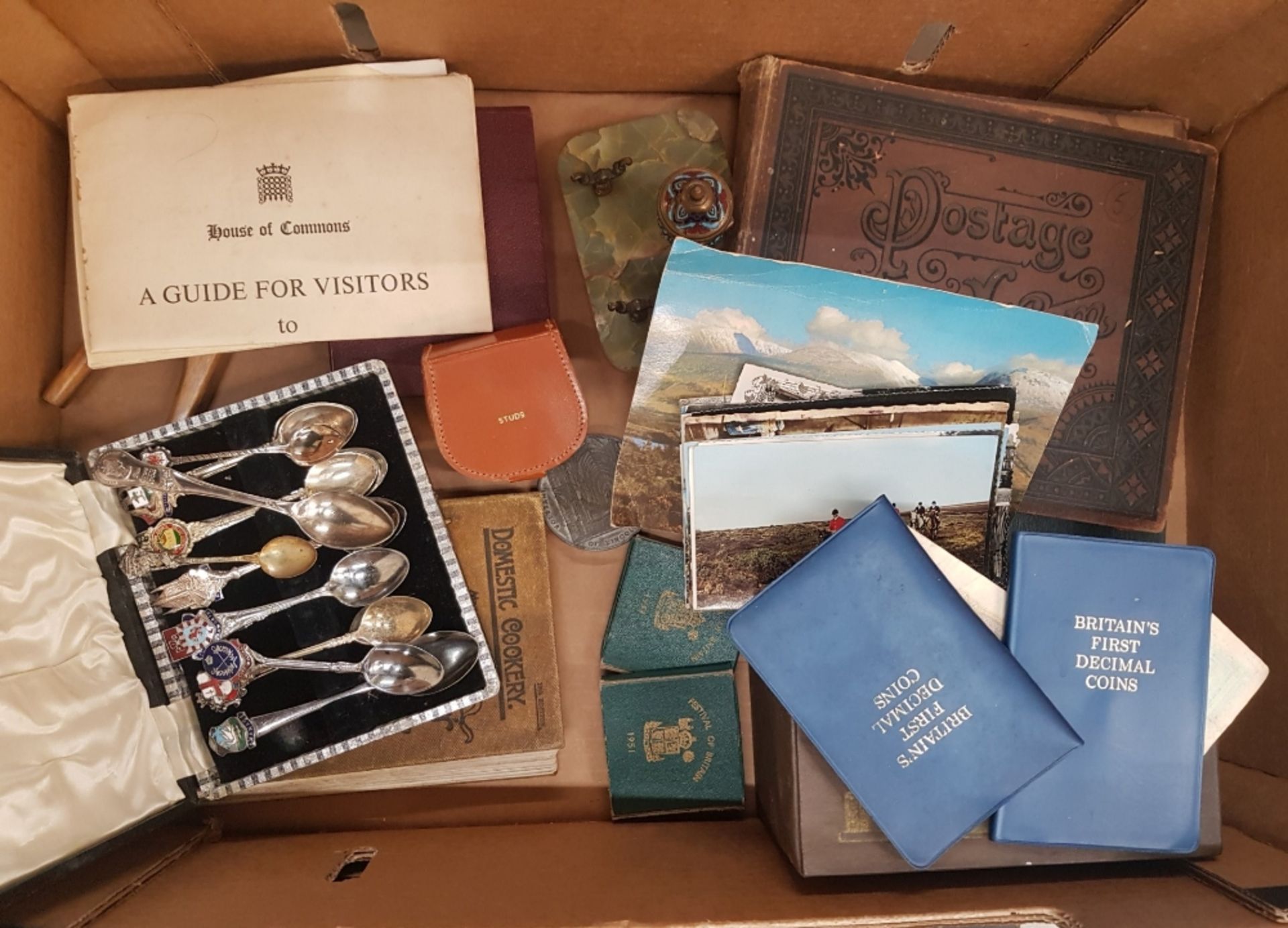 A mixed collection of items to include stamp albums, commemorative coins and coin sets, collectors