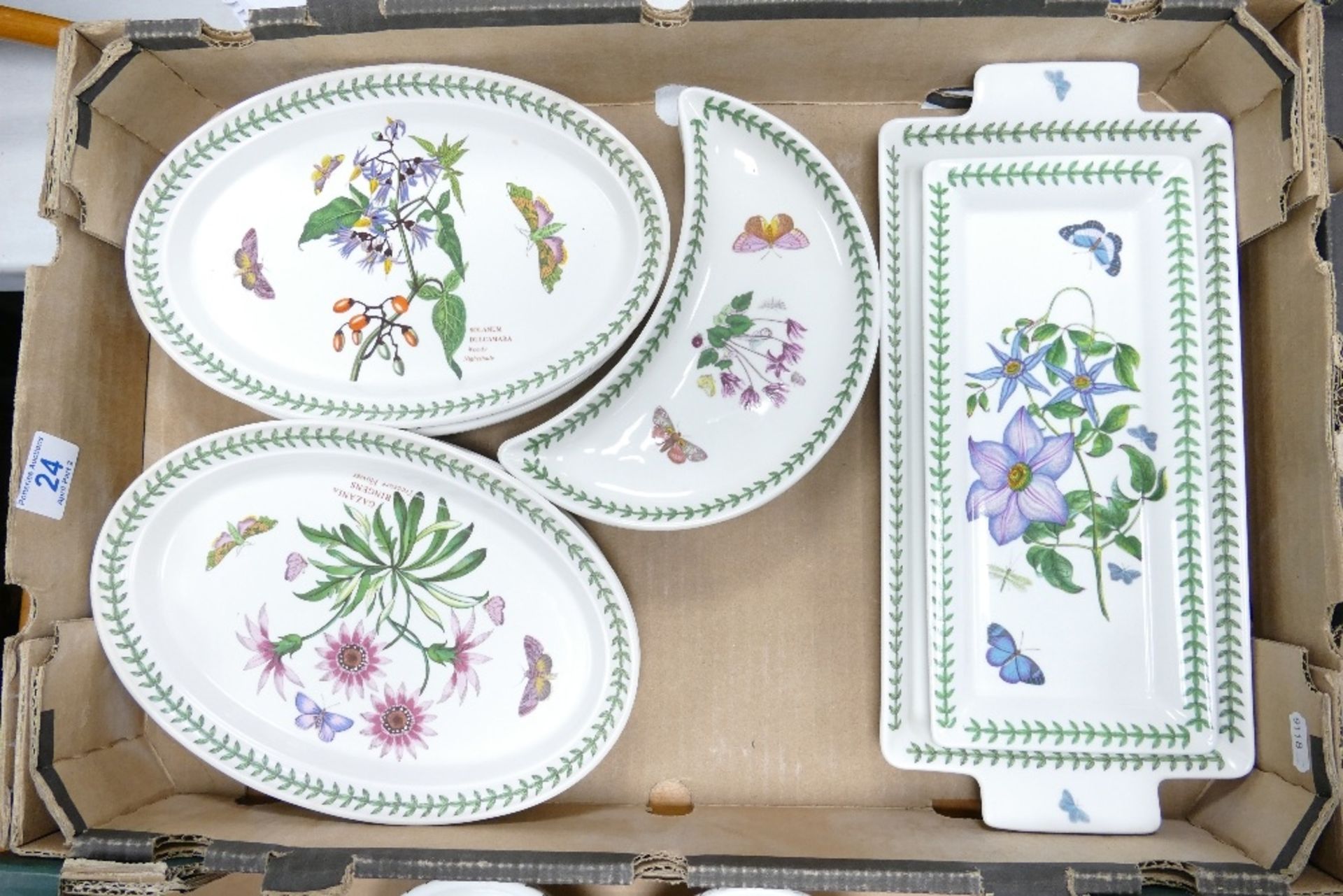 A collection of Portmeirion Botanic patterned items including oval serving platters, crescent shaped