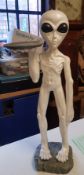 Alien figure holding ashtray, height 66cm