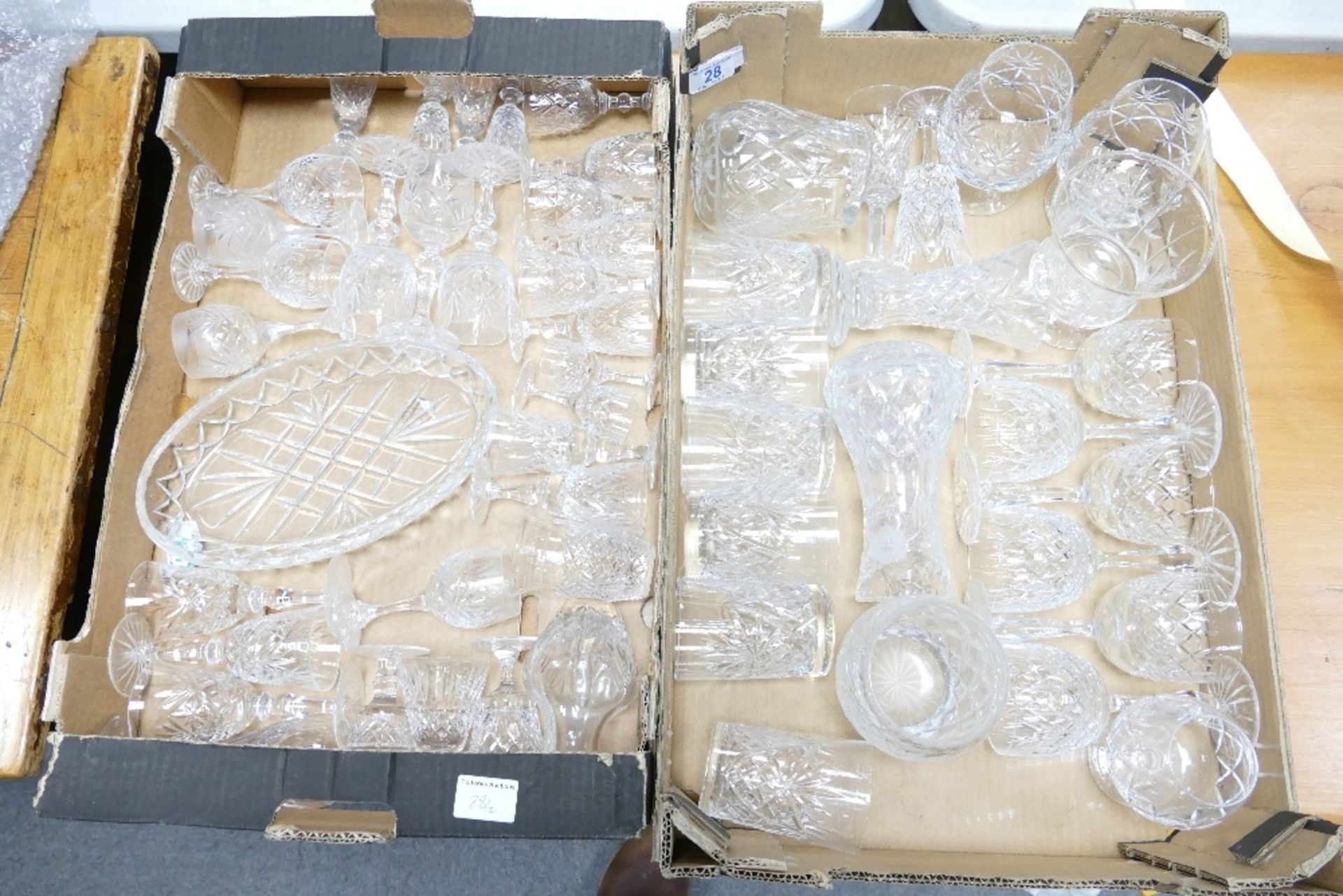 A large collection of cut glass wine glasses, port glasses, sherry glasses etc(2 tray)