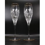 two Atlantis Cut Glass Crystal Champagne Flutes with gold rims, height 16.5cm
