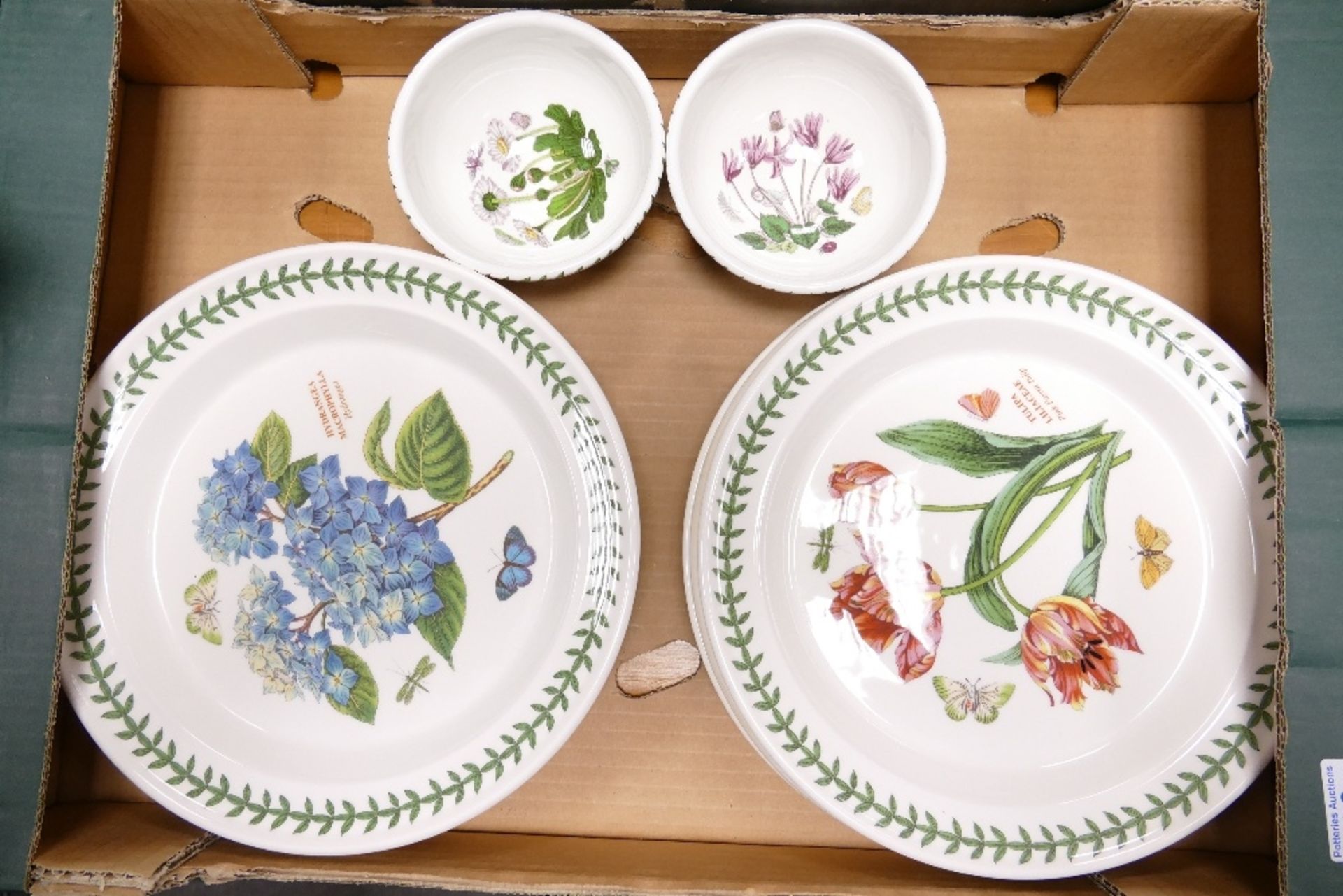 A collection of Portmeirion Botanic patterned items including dinner plates, finger bowls etc