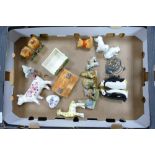 A mixed collection of items to include Wade animals, Beswick Winnie the Pooh figure, continental cow