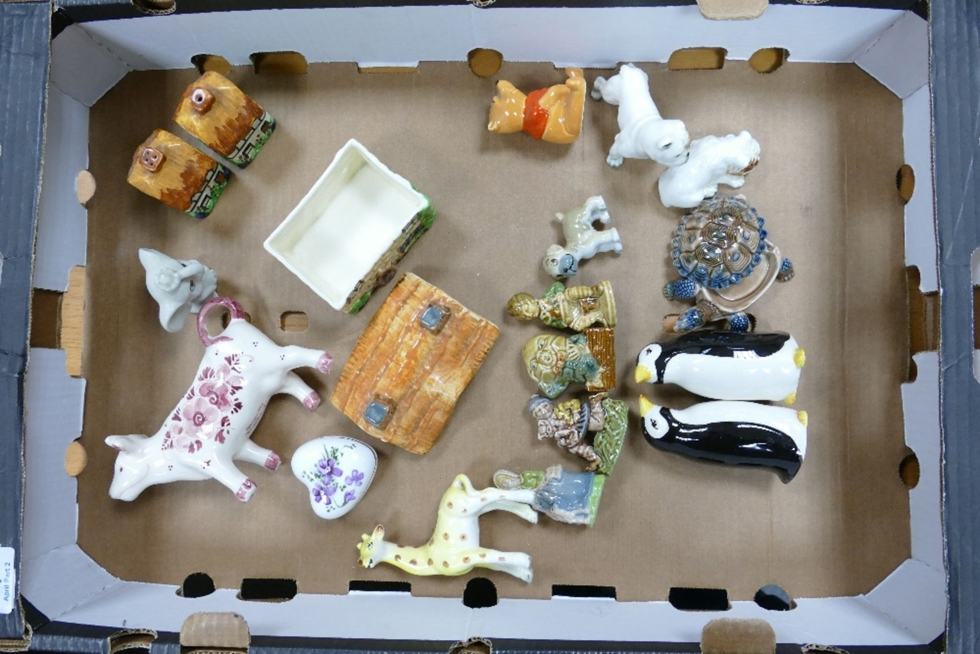 A mixed collection of items to include Wade animals, Beswick Winnie the Pooh figure, continental cow