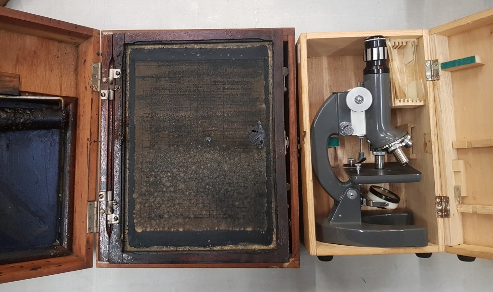 A cased student's microscope together with a vintage oak cased silk screen printing hand press (2).