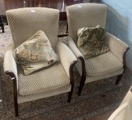 Matching ladies and gents green upholstered armchairs (2).