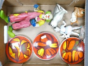 A mixed collection of items to include three Poole pottery pin dishes, Goebel Happy Clown, Beswick