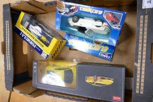 A collection of Boxed Model Toy Cars including Rastar Lamborghini Huracan Lp 610-4, Corgi Electronic