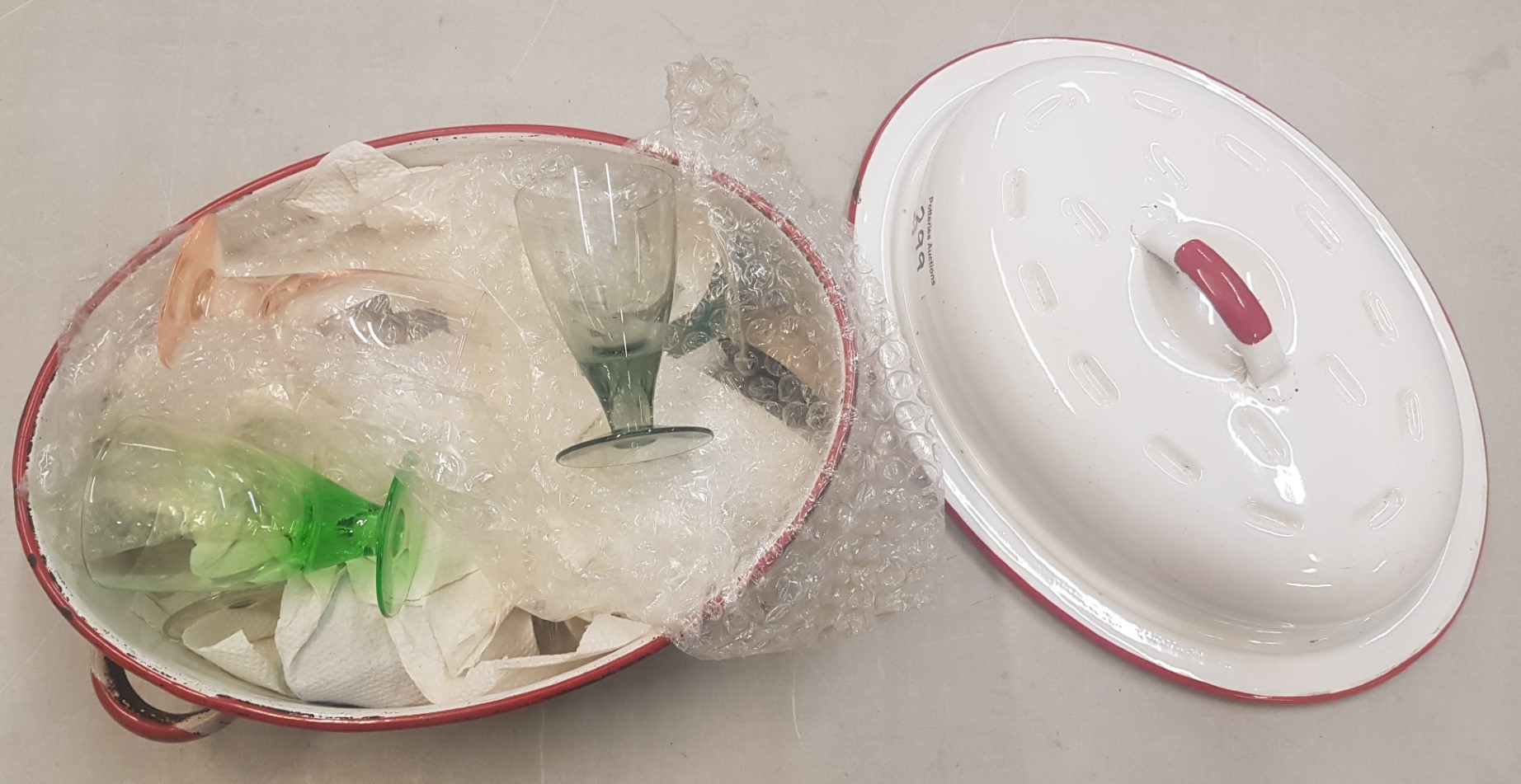 Vintage red and white enamel Roasting dish together with multicoloured sherry glasses (inside dish)