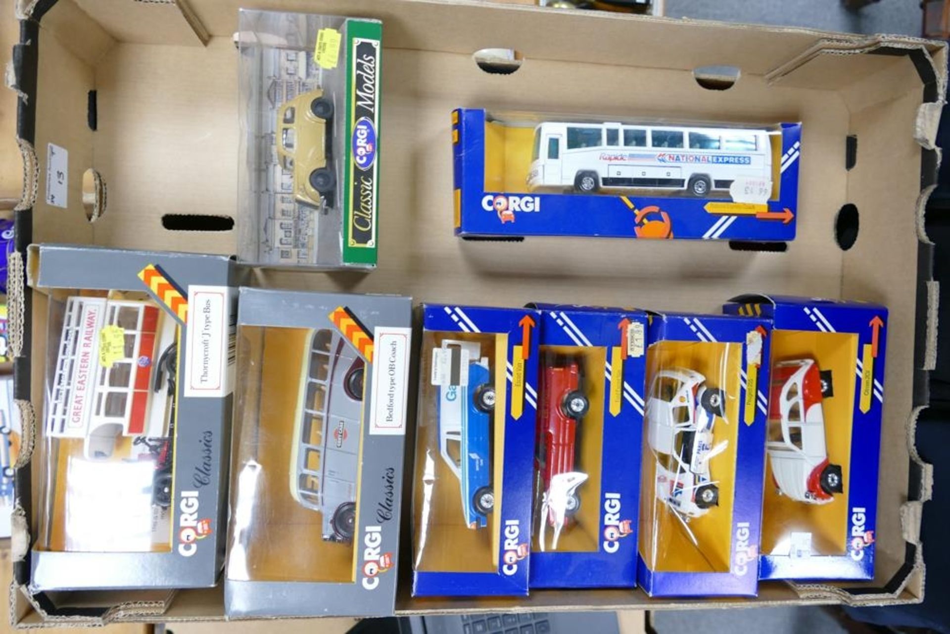 A collection of Boxed Corgi Die Cast Model Toy Cars including National Express Coach, Citroen 2cv,