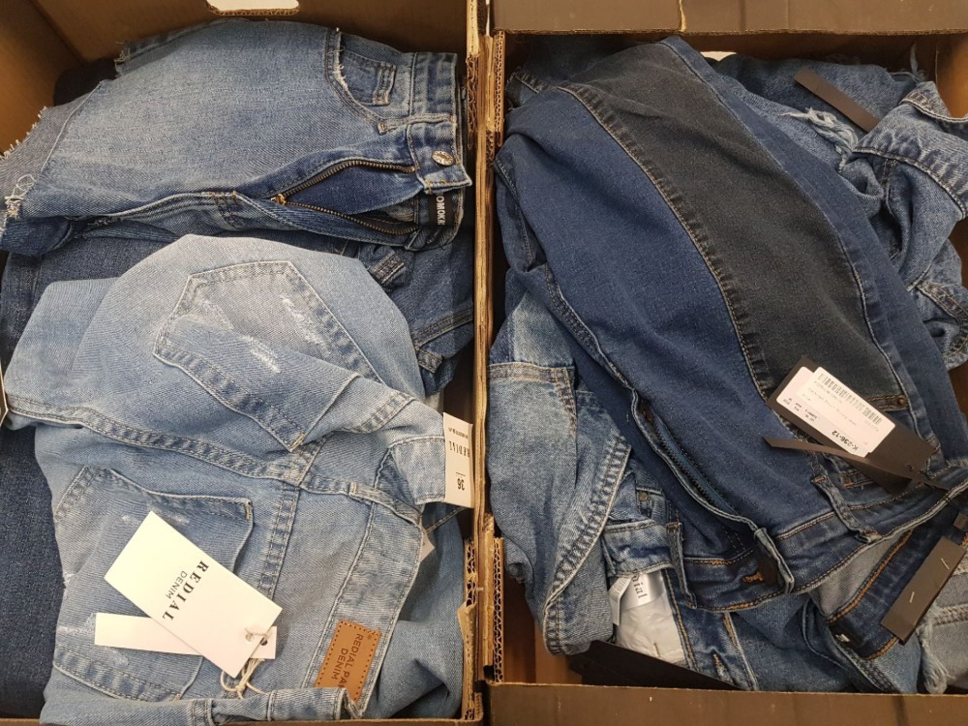 A quantity of BNWT ladies denim clothing items, jeans, shorts, jackets, mixed sizes (2 trays).